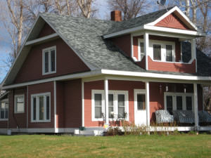 Ranch style house with red siding