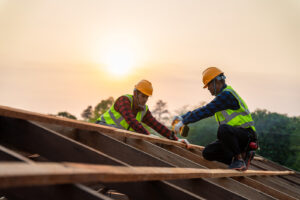 Roofers installing a roof