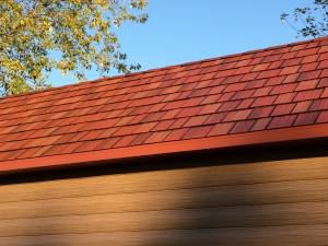 Red metal roofing on a home