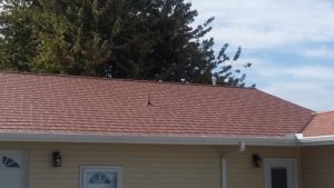 Red metal roofing on a home